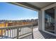 Back patio with seating area offers a scenic view of the neighborhood on a sunny day at 9501 Richfield St, Commerce City, CO 80022