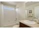 Bathroom with shower-tub combo, an undermount sink, and tile flooring at 2033 E 167Th Way, Thornton, CO 80602