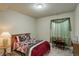 Bedroom features neutral walls, carpet, window, and a bed with a floral comforter set at 2033 E 167Th Way, Thornton, CO 80602