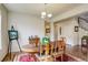 Well-lit dining room with wood floors, a chandelier, an easel and artwork at 2033 E 167Th Way, Thornton, CO 80602