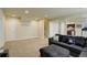 Finished basement living room with carpet, recessed lighting and a large sectional couch at 2033 E 167Th Way, Thornton, CO 80602