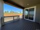 Outdoor deck overlooking the backyard with sliding door access to the dining room at 737 Raindance St, Erie, CO 80516
