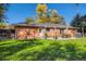 This backyard patio features a table, chairs, grill, and firepit on the patio at 6642 S Pearl St, Centennial, CO 80121