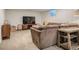 Cozy basement living area with comfortable seating and entertainment center at 6642 S Pearl St, Centennial, CO 80121