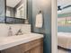 Cozy bathroom with modern vanity and decorative details, offering a glimpse into the bedroom at 6642 S Pearl St, Centennial, CO 80121