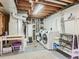 Functional laundry room with modern appliances and storage solutions at 6642 S Pearl St, Centennial, CO 80121