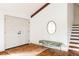 Bright foyer features double doors, geometric tile, a statement mirror, and staircase at 3624 S Poplar St, Denver, CO 80237