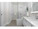 Modern bathroom with a glass shower, a double vanity, and contemporary fixtures at 155 Steele St # 917, Denver, CO 80206