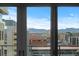 Views of city buildings and distant mountains from inside the apartment at 155 Steele St # 917, Denver, CO 80206