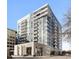 Modern building featuring multiple floors with balconies and large windows offers city views at 155 Steele St # 917, Denver, CO 80206