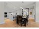 Open concept kitchen and dining area with modern lighting and stainless steel appliances at 155 Steele St # 917, Denver, CO 80206