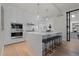 Contemporary kitchen featuring a large island with seating, white cabinetry, and modern appliances at 155 Steele St # 917, Denver, CO 80206