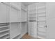 Spacious walk-in closet with custom shelving, drawers, and ample storage space at 155 Steele St # 917, Denver, CO 80206