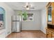 Cozy dining room featuring a stainless steel refrigerator and a ceiling fan at 8991 Hickory Pl, Thornton, CO 80229