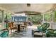 Covered back patio furnished with multiple seating areas, creating a relaxing outdoor space at 8991 Hickory Pl, Thornton, CO 80229