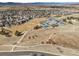 This aerial view captures the scale and landscape of the community and the convenient access to the playground and athletic fields at 4321 Old Windmill Way, Castle Rock, CO 80109