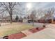 Backyard with grassy area, shed, and playground at 614 Glenwood Dr, Lafayette, CO 80026