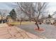 Large backyard with patio, shed, and play area at 614 Glenwood Dr, Lafayette, CO 80026