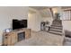 Finished basement with TV, fireplace, and seating area at 614 Glenwood Dr, Lafayette, CO 80026