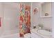 Clean bathroom with floral shower curtain and a vanity at 614 Glenwood Dr, Lafayette, CO 80026