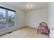 bedroom with a red bed and large window at 614 Glenwood Dr, Lafayette, CO 80026