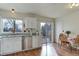 Bright kitchen with granite countertops and sliding door access at 614 Glenwood Dr, Lafayette, CO 80026