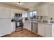 Kitchen boasts stainless steel appliances and granite countertops at 614 Glenwood Dr, Lafayette, CO 80026