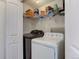 Laundry room with washer, dryer, and shelving at 614 Glenwood Dr, Lafayette, CO 80026