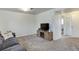 Living room featuring a sofa, TV, and fireplace at 614 Glenwood Dr, Lafayette, CO 80026