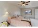 Main bedroom with a ceiling fan and window at 614 Glenwood Dr, Lafayette, CO 80026