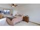 Spacious main bedroom with a ceiling fan and large windows at 614 Glenwood Dr, Lafayette, CO 80026