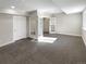 Finished basement with an office and grey carpet at 26226 E Canal Pl, Aurora, CO 80018