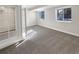 Finished basement with grey carpet and two windows at 26226 E Canal Pl, Aurora, CO 80018