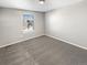 Carpeted bedroom with window and neutral walls at 26226 E Canal Pl, Aurora, CO 80018