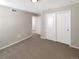 Carpeted bedroom with double door closet and neutral walls at 26226 E Canal Pl, Aurora, CO 80018