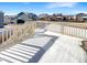 Back deck overlooking the snow covered backyard at 26226 E Canal Pl, Aurora, CO 80018