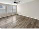 Bright living room with hardwood floors and ceiling fan at 26226 E Canal Pl, Aurora, CO 80018