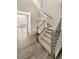 Staircase with gray railing and carpeted steps at 26226 E Canal Pl, Aurora, CO 80018