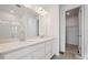 Modern bathroom features a double vanity and a glass-enclosed shower at 24740 E 39Th Ave, Aurora, CO 80019