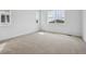 Bright bedroom with large windows and plush carpeting for a comfortable living space at 24740 E 39Th Ave, Aurora, CO 80019