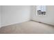 Spacious bedroom with plush carpet, a window for natural light, and neutral walls at 24740 E 39Th Ave, Aurora, CO 80019