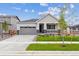 Charming single-story home with well-manicured lawn, gray siding, and a covered front porch at 24740 E 39Th Ave, Aurora, CO 80019