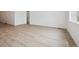 Spacious living area with light wood flooring and ample natural light from large windows at 24740 E 39Th Ave, Aurora, CO 80019