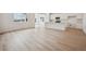 Bright living space and modern kitchen featuring lots of natural light, hardwood flooring, and an open floor plan at 24740 E 39Th Ave, Aurora, CO 80019