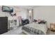 Bedroom with window, carpeted floor, and wall-mounted television at 5149 S Genoa Ct, Centennial, CO 80015
