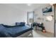 Bedroom with white walls, natural lighting, and carpeted flooring at 5149 S Genoa Ct, Centennial, CO 80015