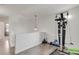 Bright bonus room featuring exercise equipment and wood-look flooring at 5149 S Genoa Ct, Centennial, CO 80015