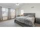 Spacious main bedroom featuring vaulted ceiling, large windows, and wall to wall carpeting at 5149 S Genoa Ct, Centennial, CO 80015