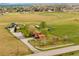 Lush lot featuring a single-Gathering home with a white fence, mature trees and lake views at 6310 W County Road 4, Berthoud, CO 80513