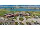 Aerial view of golf course with clubhouse and large lake at 6310 W County Road 4, Berthoud, CO 80513
